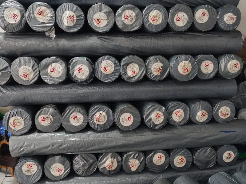 Stok roll terpal silver abu-abu berlabel Yo Nusantara Raya